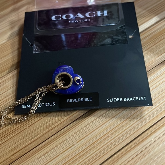 Coach Semi Precious Lapis slider bracelet
Reversible open heart charm - Picture 3 of 5